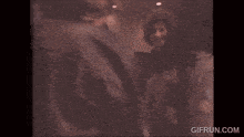 two men wearing headphones are giving each other a high five while dancing .