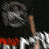 a blurry picture of a person with a helmet on and the word nebraska on the bottom