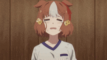 a girl with a dog ear is crying with tears running down her face
