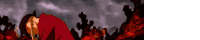 a man in a red shirt is laying in a field of fire .