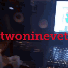 twoninevet is written in red letters on a dark background