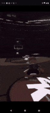 a basketball game is being played on a cell phone screen