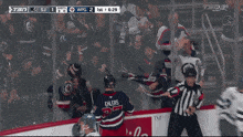 a hockey game is being played between the winnipeg jets and the calgary canucks