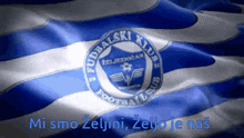 a blue and white flag with fudbalski klub in the center