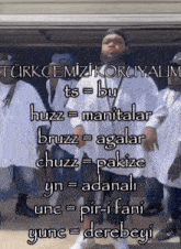 a group of men standing in front of a sign that says ' turkcemizi koruyalim ' on it