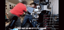 a video of two men fighting with the words get out of my f *** house
