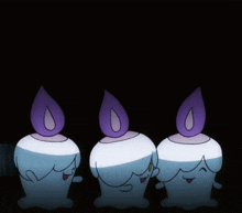 three cartoon candles with purple candles on top of them