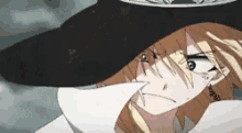 a close up of a person wearing a cowboy hat