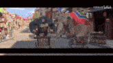 a gorilla and an elephant are riding a bike down a street