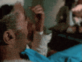 a close up of a man 's face with a blurred background