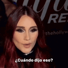 a woman with red hair says " cuando dijo eso "