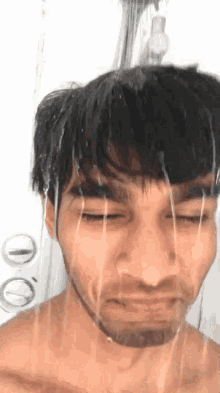 a man taking a shower with water coming out of his head