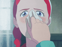 a woman with red hair blowing her nose with a napkin