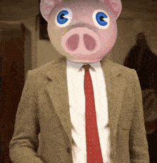 a man wearing a suit and tie with a pink pig head