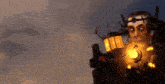 a statue of a man with a crown on his head is holding a glowing object