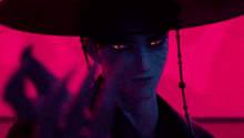 a man in a hat with red eyes is standing in front of a pink wall