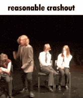 a group of people on a stage with the words reasonable crashout on the bottom