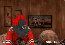 a couple of people with masks on their faces and a nbc logo on the bottom right