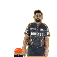 a man is wearing a jersey that says dream11