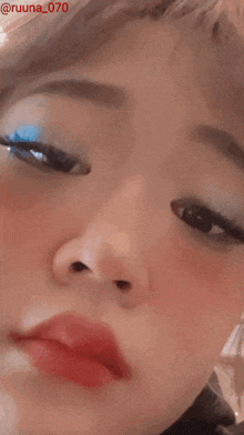 a close up of a woman 's face with the name ruuna on the bottom right