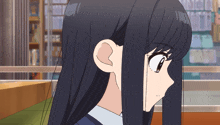 a close up of a girl 's face with long hair