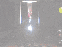 a disco ball is being smashed by a person on the floor