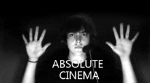 a man wearing headphones and a microphone with the words absolute cinema written above him