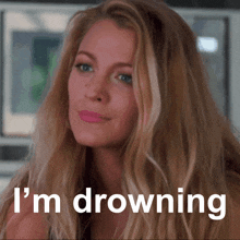 a woman says i 'm drowning in front of a microwave