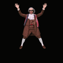 a man in a benjaminstv costume is jumping in the air with his arms in the air