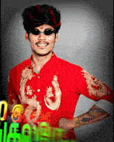 a man wearing a red shirt with dragons on the sleeves