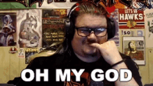 a man wearing headphones and glasses says oh my god