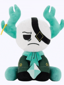 a stuffed animal with antlers and a diamond in its mouth