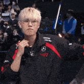 a man wearing glasses and a jacket that says samsung