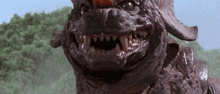a close up of a monster 's face with sharp teeth