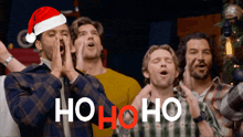 a group of men are singing ho ho ho