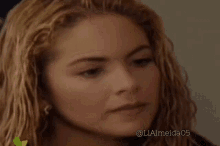 a close up of a woman 's face with the hashtag liaimeida05