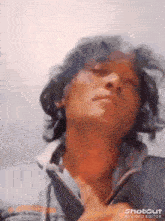 a close up of a man 's face with a shotcut ai video editor watermark on the bottom