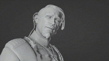 a black and white photo of a statue of a man