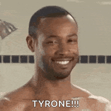 a shirtless man is smiling in a shower and saying tyrone !!!