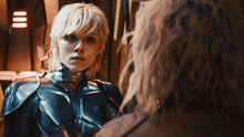 a woman in a superhero costume looks at another person