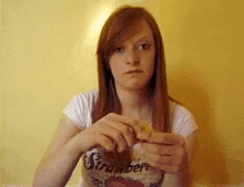 a young woman wearing a shirt that says stranger on it
