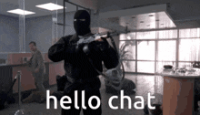 a man in a mask is holding a gun with the words hello chat written below him