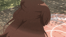 a woman with long brown hair is standing on a brick walkway