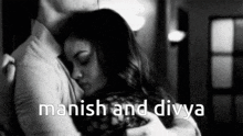 a man is hugging a woman in a black and white photo with the words manish and divya above them
