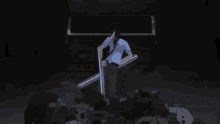 a man in a blue shirt is holding a pair of scissors in front of a pile of trash .