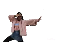a girl wearing a pink jacket and a blue skirt is holding a bunch of red hearts