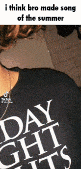 a person wearing a shirt that says day nights on it