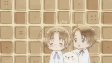 two anime characters are standing next to each other holding a teddy bear in front of a wall .