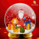 a snow globe with gifts and a bitcoin coin