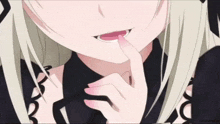 a close up of a girl 's face with her finger on her lips